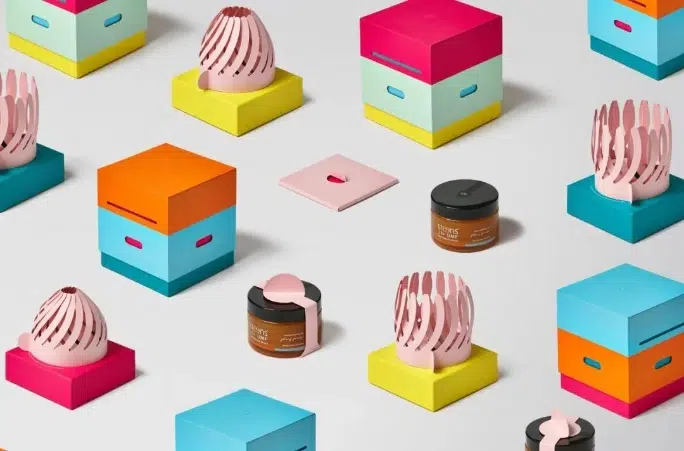 Paper petal structure unfolding to reveal honey jar